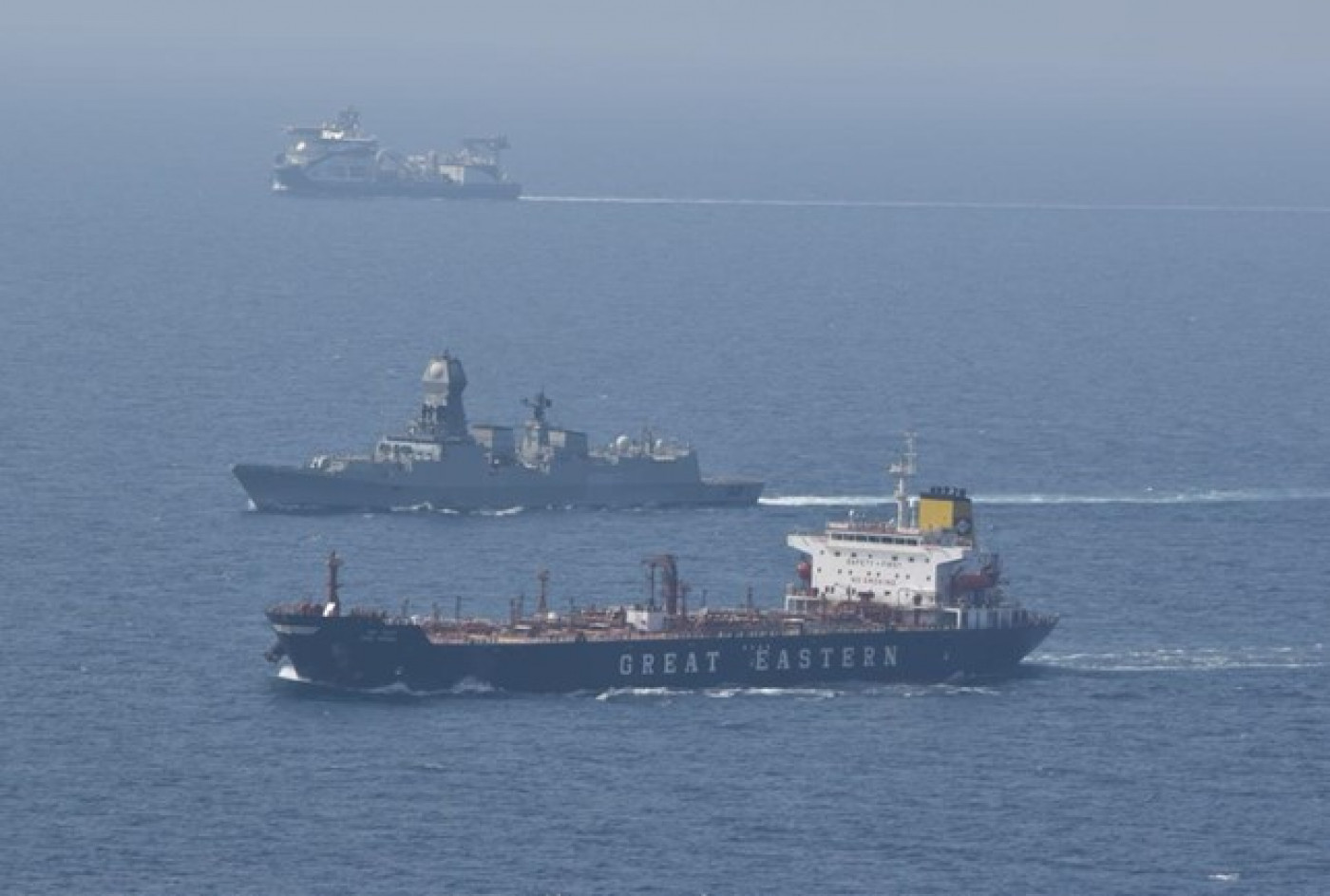 Indian naval ship beside a merchant cargo ship in the Gulf of Aden, January 2024. Image provided by 