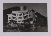 The photograph is a stern view of the wreck of the Magdalena in situ