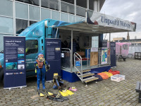 Unpath’d Waters exhibition bus stationed at Dundee. This initiative allowed local communities all over the UK to interact with maritime heritage stories and virtual experiences.